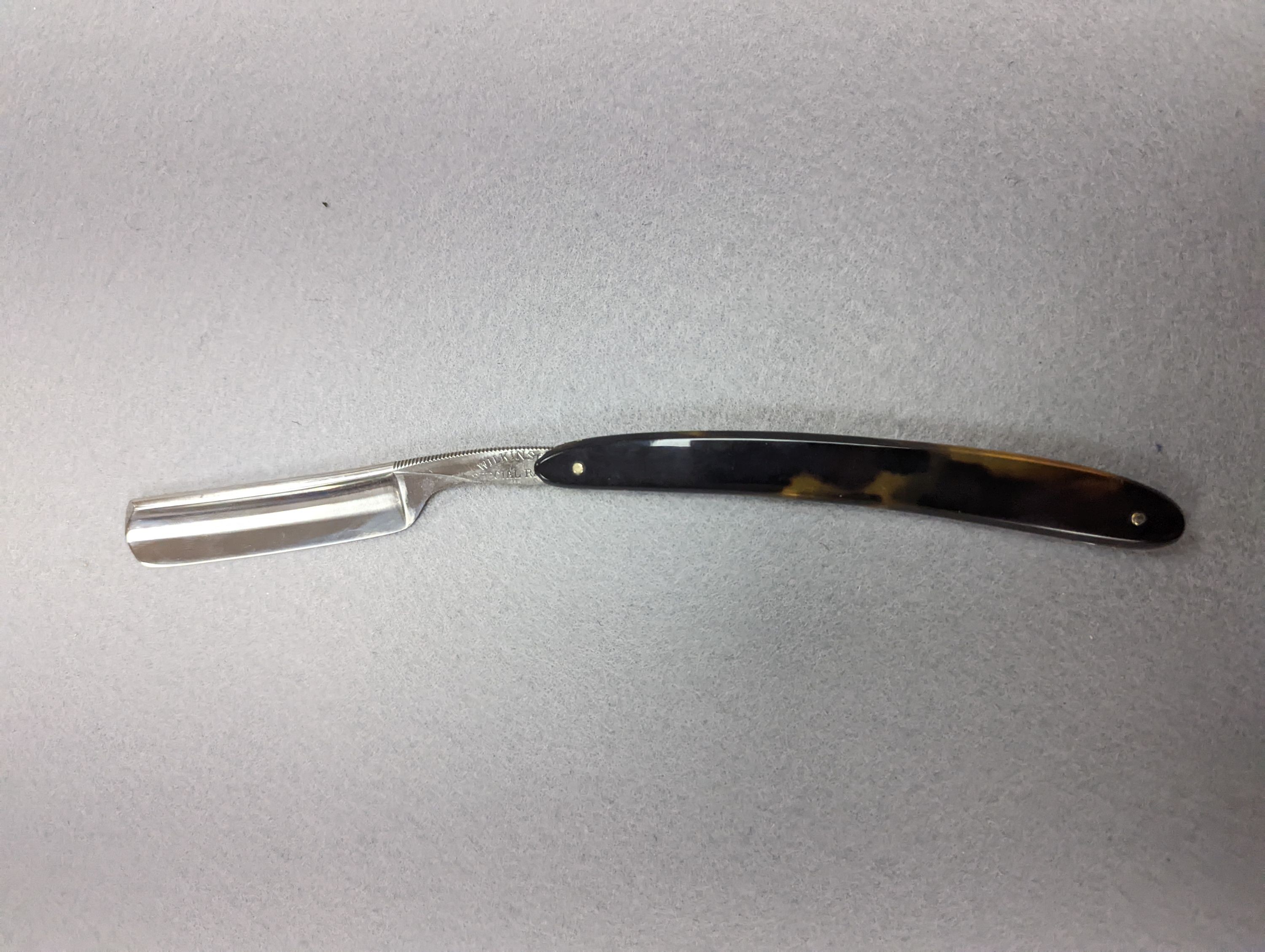 A set of seven tortoiseshell handled cut throat razors for the days of the week Wilkinson and a cased pair of tortoiseshell handled razors, C&W Higginbottom